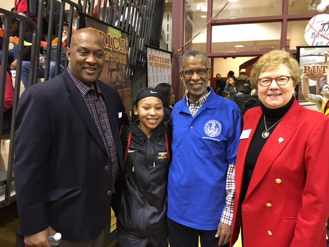 Congressman Dwight Evans, CHC sophomore and basketball player, Mary Trossi, Senator Art Haywood, and Sister Carol Jean Vale, CHC president, pose after the game February 11.