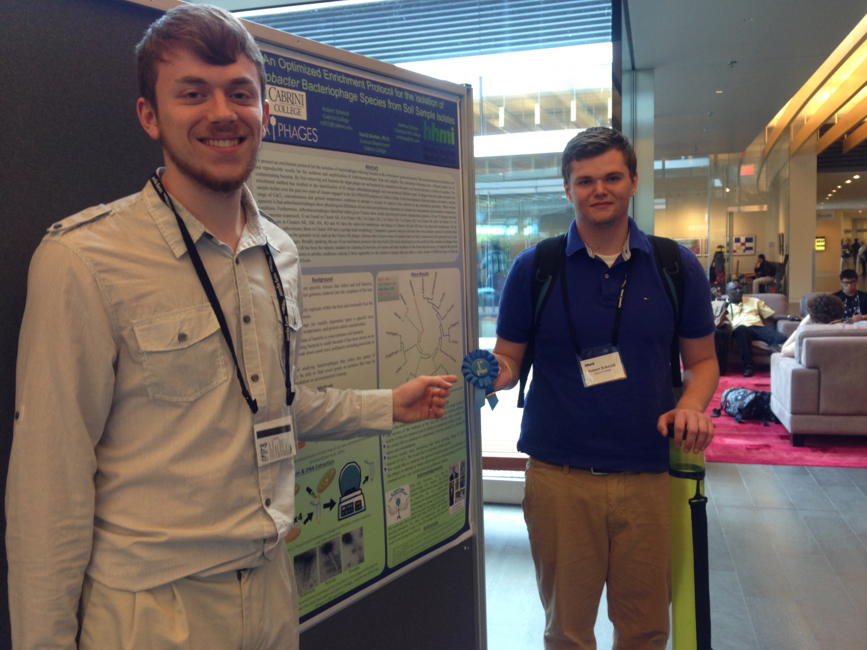 Andrew Conboy '18, left, and Robert Schmidt '17 stand with their winning poster. Photo courtesy of Andrew Conboy '18 