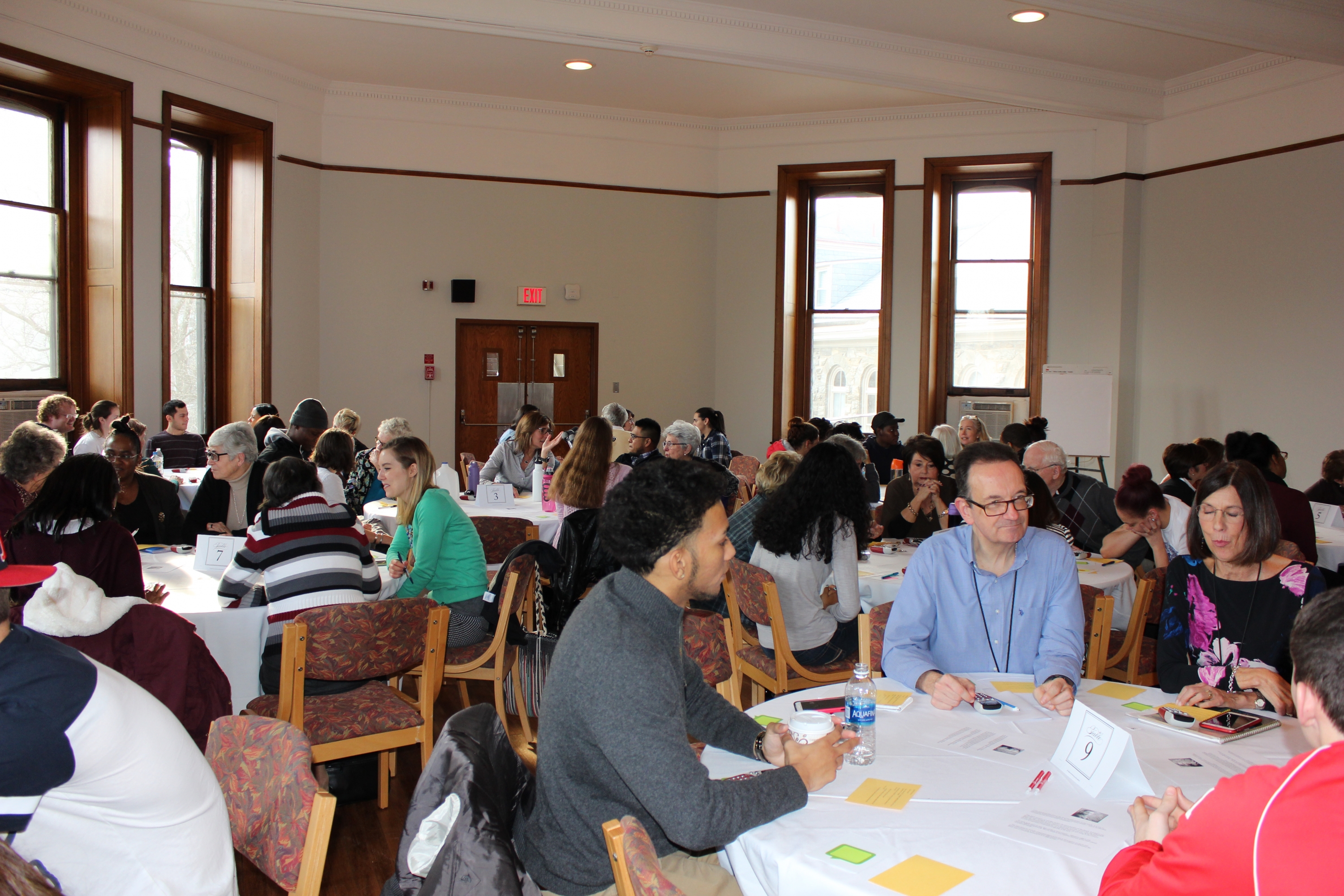 Members of the College community engage in table discussion and shared insights during the MLK Day of Remembrance.