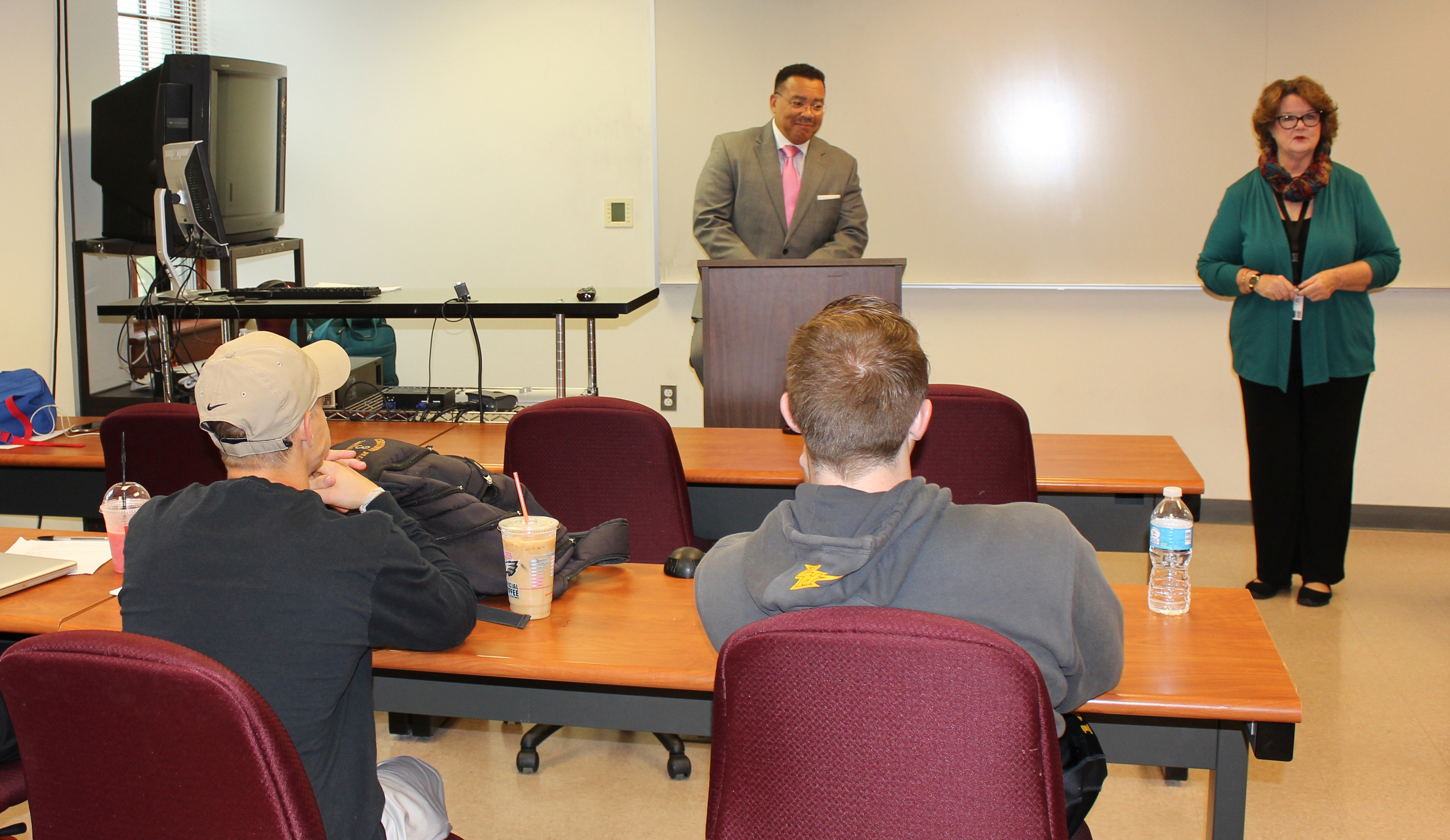 Sara Kitchen, J.D., welcomed Kevin Bethel '08 SCPS before he addressed her criminal justice class. Photo credit: Marilee Gallagher '14 