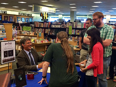 Patrick McCauley, Ph.D., signs copies of his book at a recent appearance.