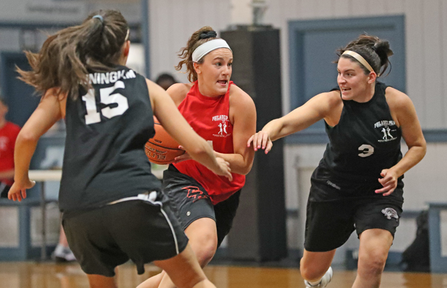 Vicky Tumasz  '18 dribbles past defenders during one of the summer league games.