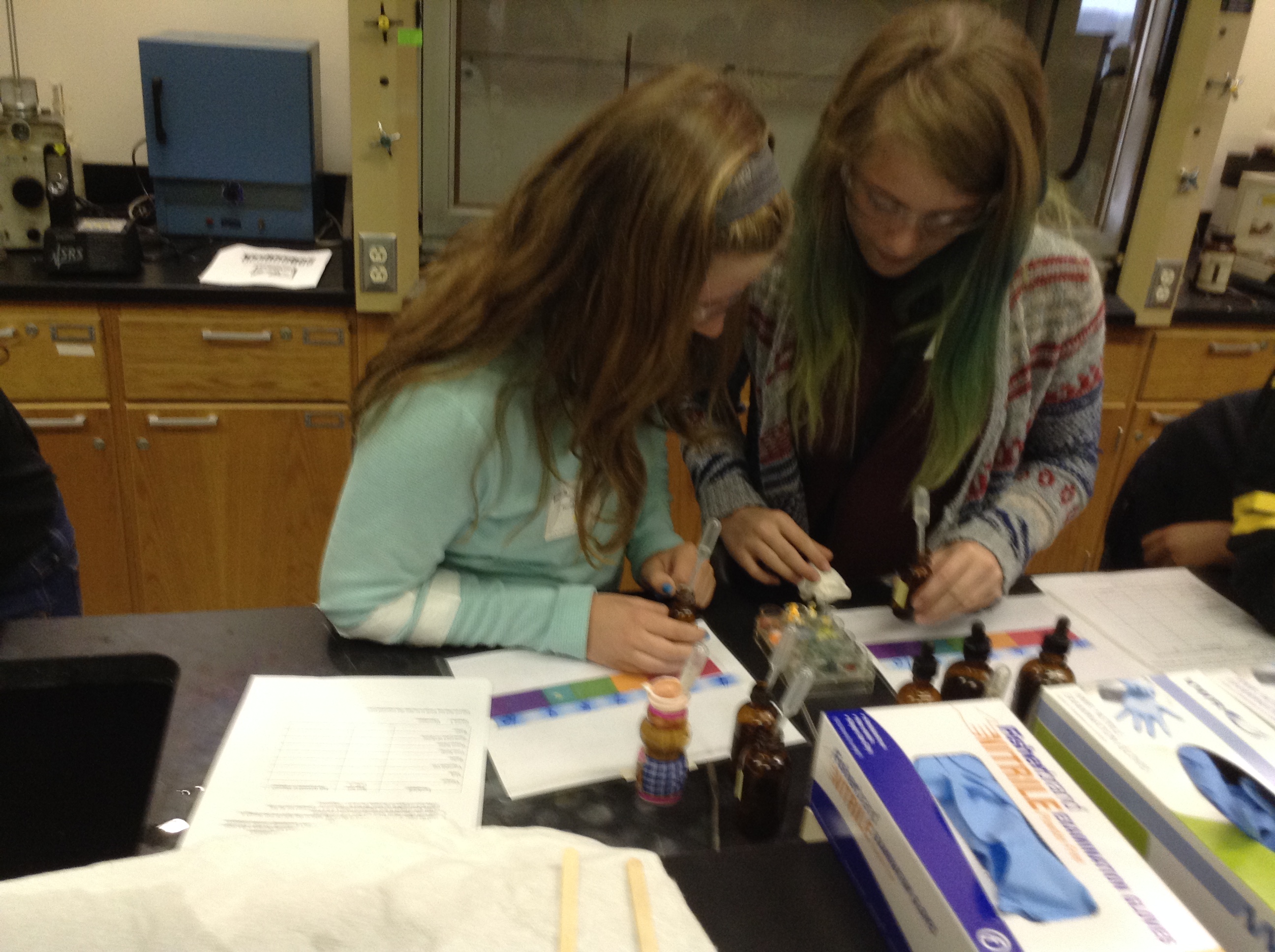 Sixth-grade girls try an experiment during the PAGES conference in April.