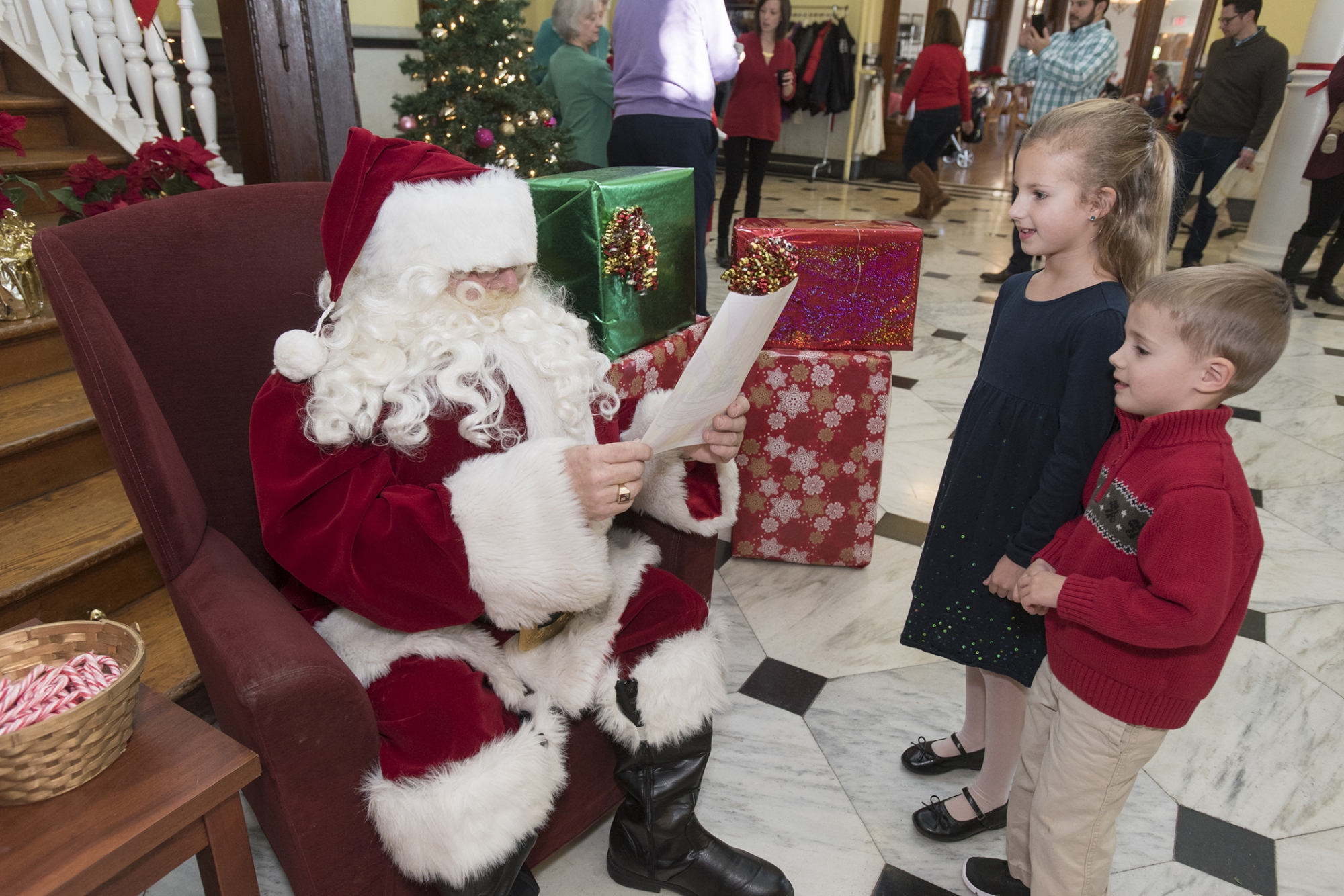 Children share their wish list with Santa.