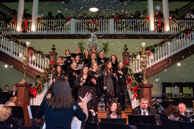 Snow fell from the rafters as the Hill Singers led the crowd in the singing of Christmas carols.