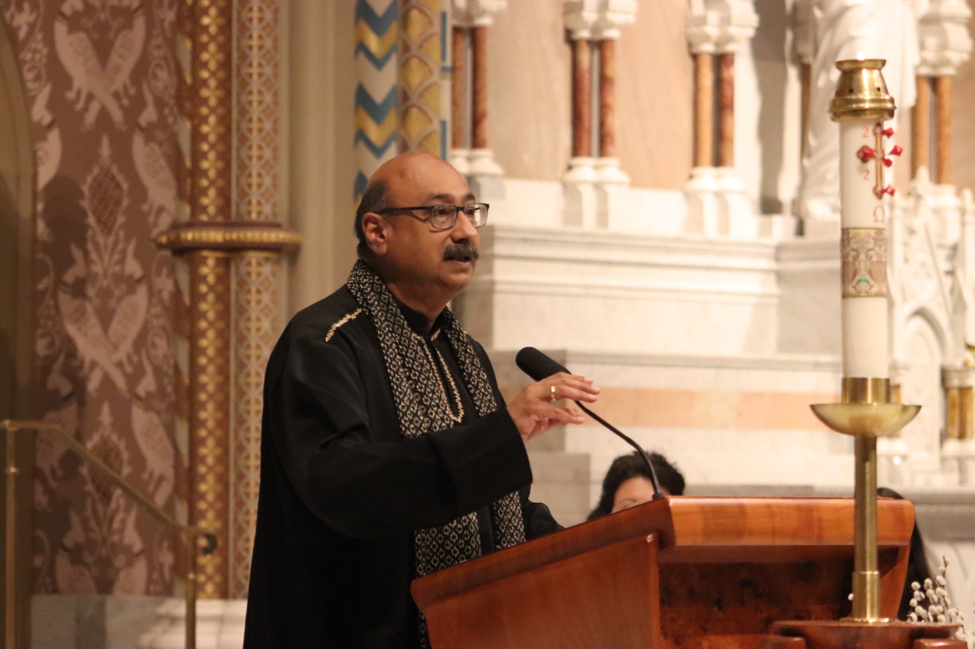 Aziz Nathoo speaks during the Baccalaureate service at Chestnut Hill College.
