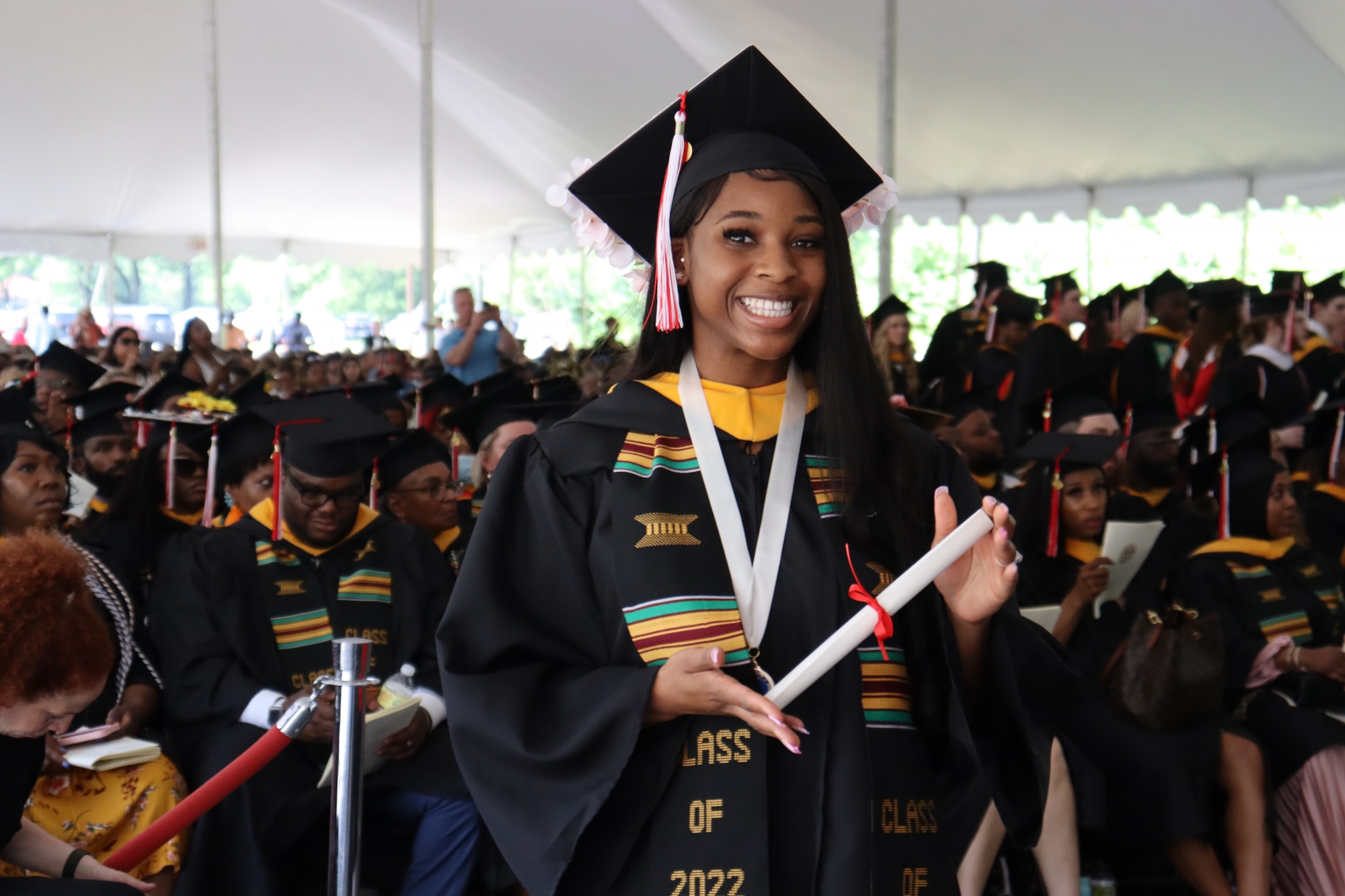 Graduates stopped and posed for photos with their diplomas after walking across the stage during Saturday's ceremony for the Class of 2022.