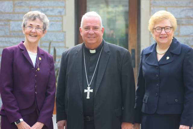 L to R: Sister Cathy Nerney stands with Archbishop Nelson Perez and Sister Carol Jean Vale in the Garden of Forgiveness.