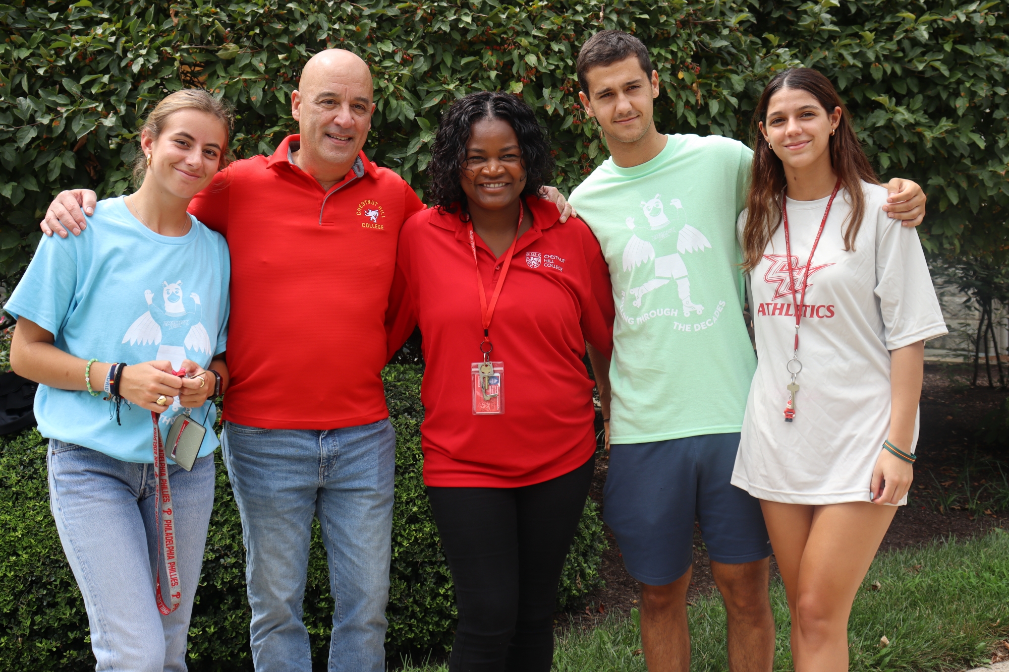 Rouseline Emmanuel-Frenel and William Latimer pose with students during this year's move=in.