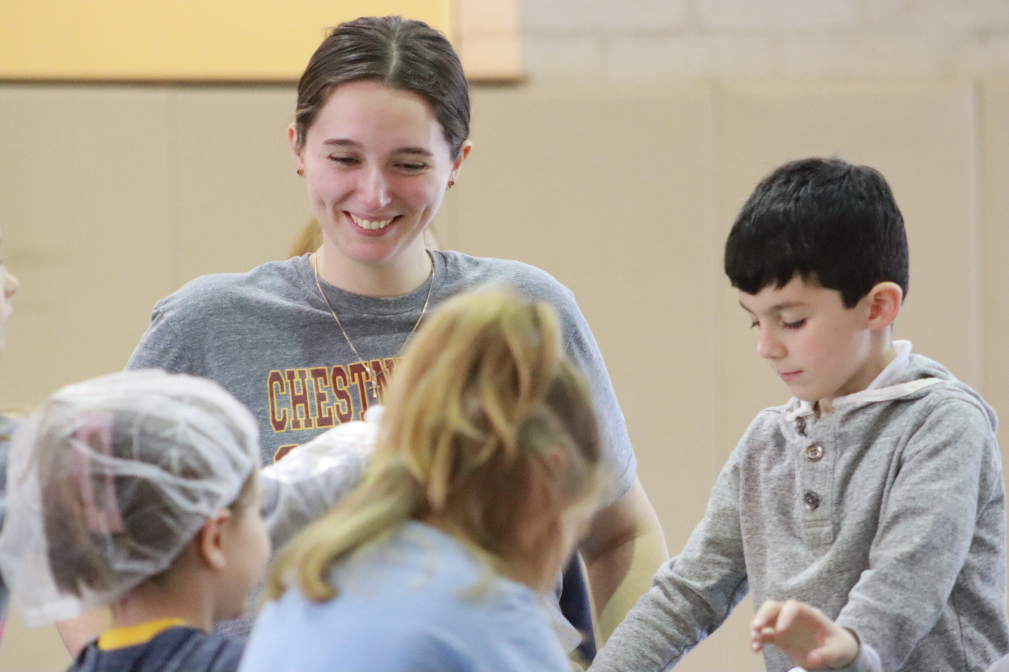 As a college leader, Jacqueline Coval helped groups of NFA students put together their meal packages.