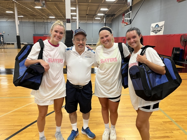 From L to R: Abbey Spratt, Lauren Crim, and Cassie Sebold pose with CHC Athletics Communications Coordinator, Bob Heller, following Team Pink's championship win.