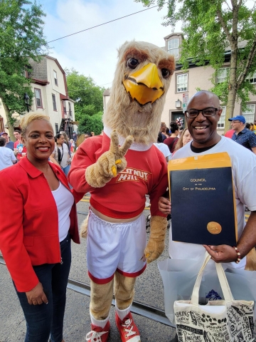 From L to R: Philadelphia Councilwoman Cindy Bass stands with CHC mascot Big Griff and Rev. James Buck Jr. during the Good Morning America broadcast in Chestnut Hill, PA