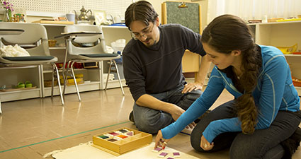 Female and male student using educational toys