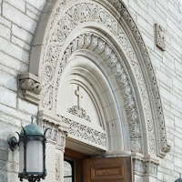 Carved arch over door to college