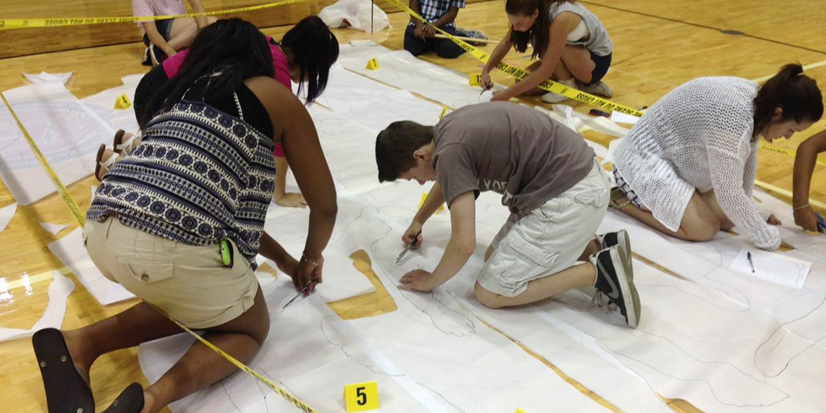 Students laying out the crime scene
