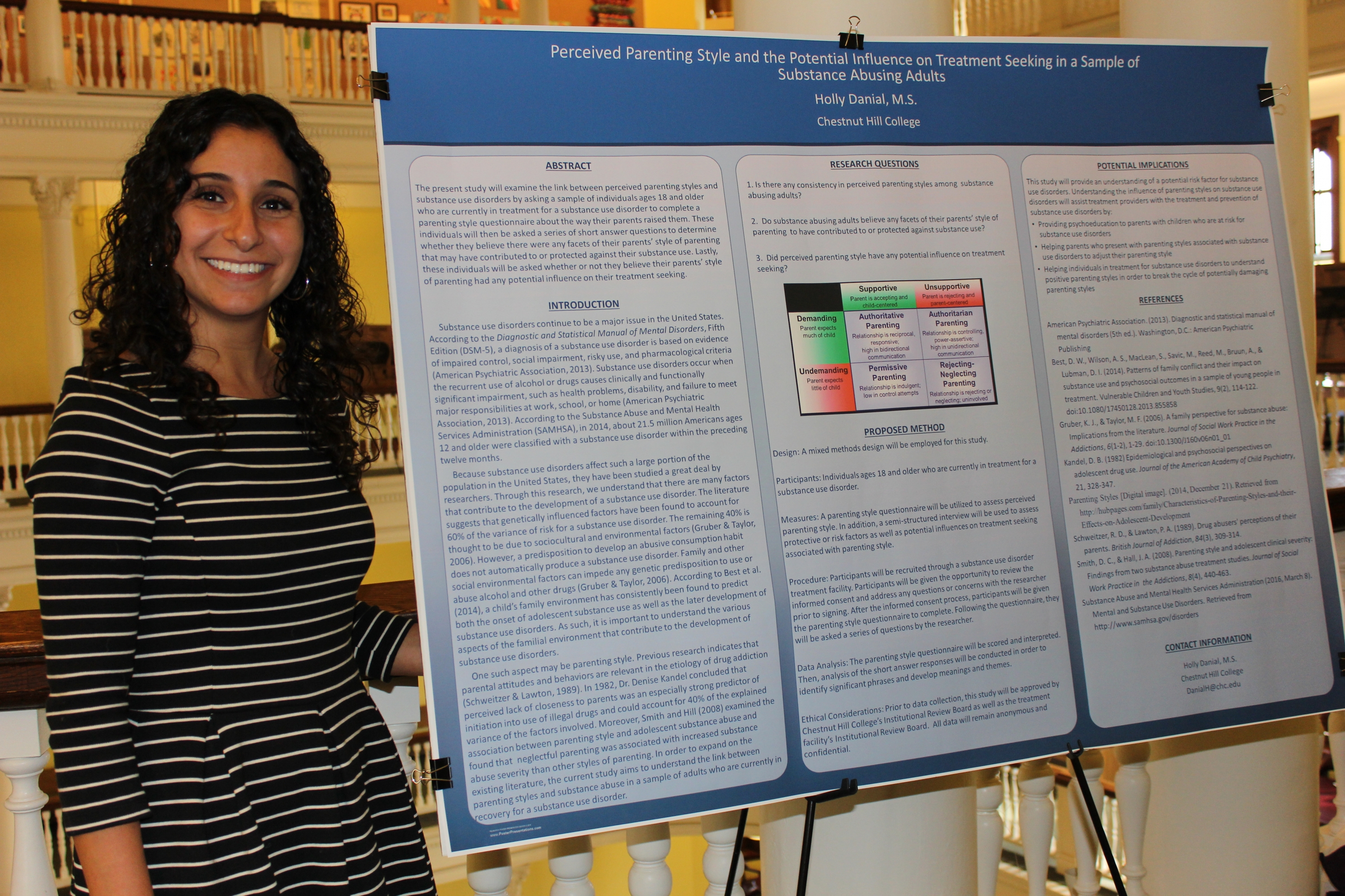 Holly Daniel, M.S., stands with her poster during the Psy.D. poster presentation in November.