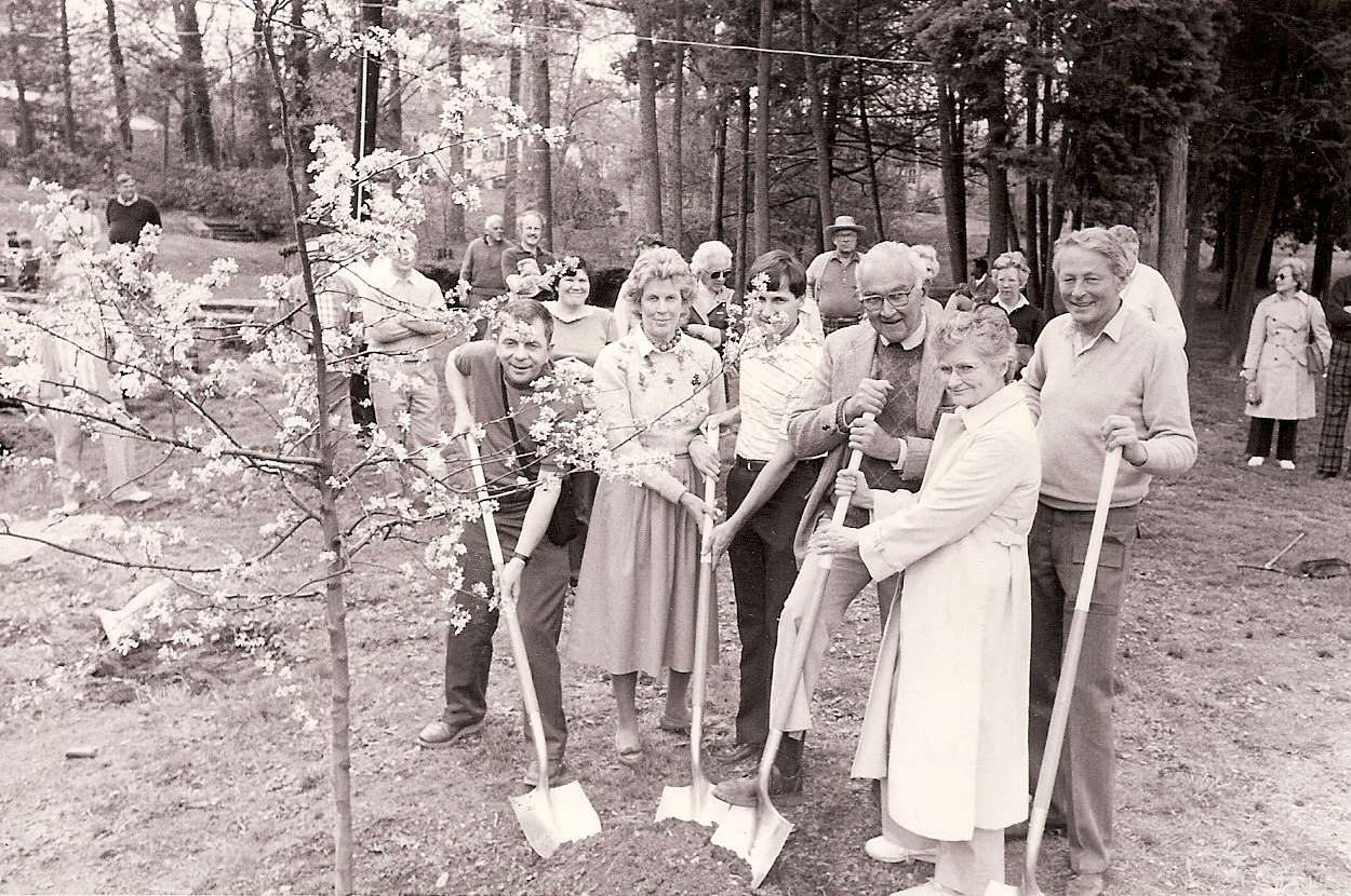 Quita Woodward Horan (second from left) plants a tree in Pastorius Park. She was a founder of Friends of Pastorius Park and a lifelong supporter of the park and many other institutions in Chestnut Hill.