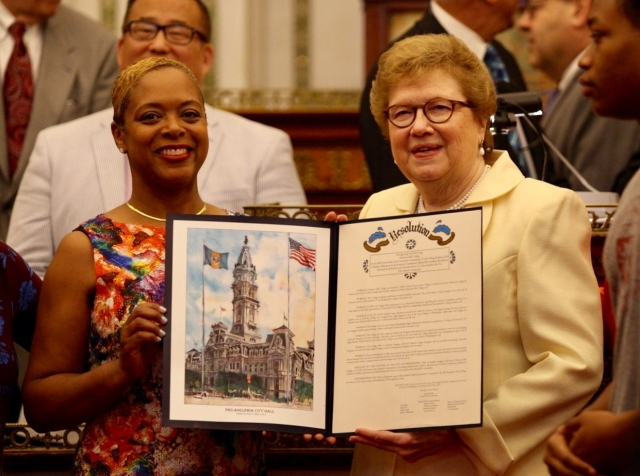 Councilwoman Cindy Bass and Sister Carol pictured with a copy of the resolution. (Photos by Margo Reed)