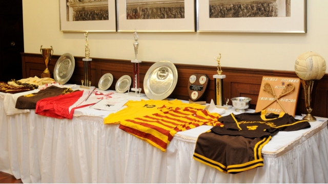 Memorabilia from the women's lacrosse team's championship-winning seasons is displayed during a Hall of Fame ceremony.