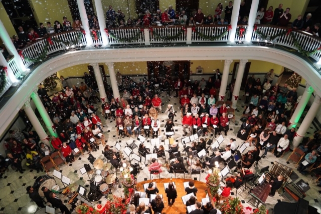 Snow falls in the rotunda during this year's Carol Night celebration. (Photo by Margo Reed)