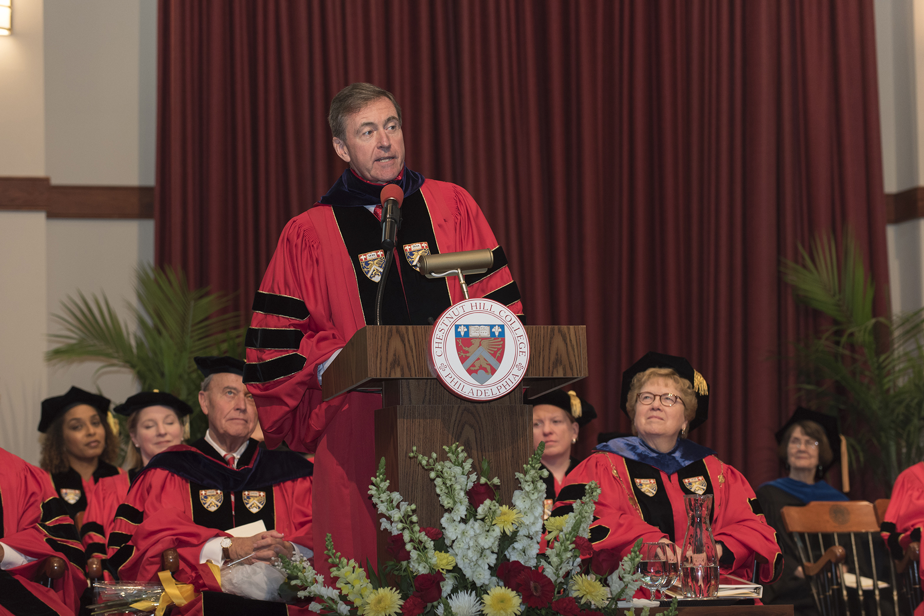 Commencement speaker, Chris Lowney, urges graduates to consider themselves to be leaders.