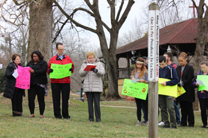 Students, faculty, and staff gathered by the Peace Pole for prayer at the conclusion of the march.