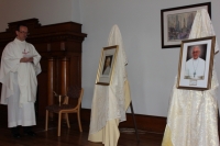 Fr. Mulligan blesses portraits of St. Pope John XXIII and Pope Francis