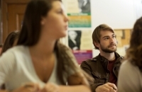 A female and male student listening to professor