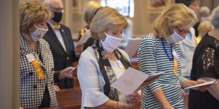 women with masks in church