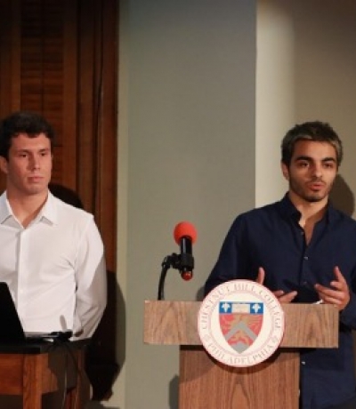 Pedro Vicente and Juan Molina, winners of the 2023 Griffin Tank, present at a podium. 