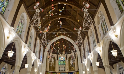 Ceiling of Broad Street Ministry. Ornamental windmills and origami birds are hung as decoration