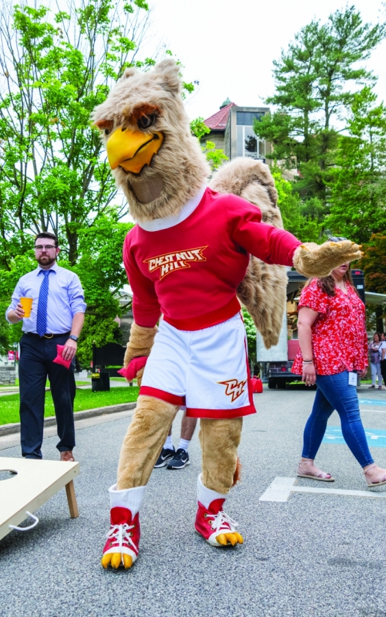 students with college mascot outside