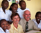 Bud and Sue Ozar '63, founders of Friends of Kenyan Orphans, with some of the kids.