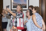group of women taking a selfie indoors