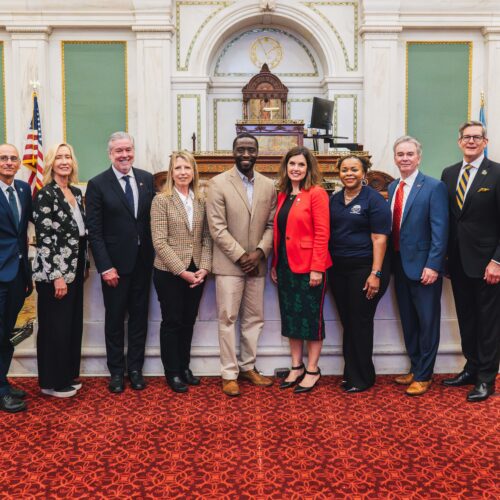 group of individuals posed at city hall