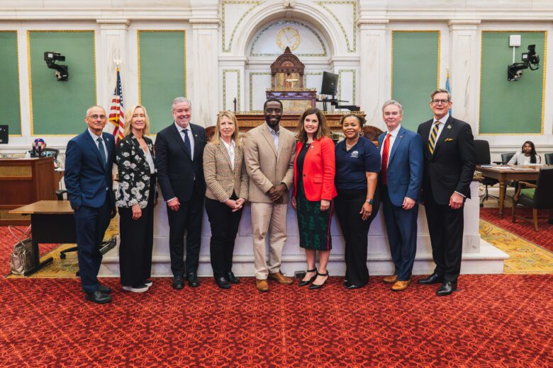 group of individuals posed at city hall