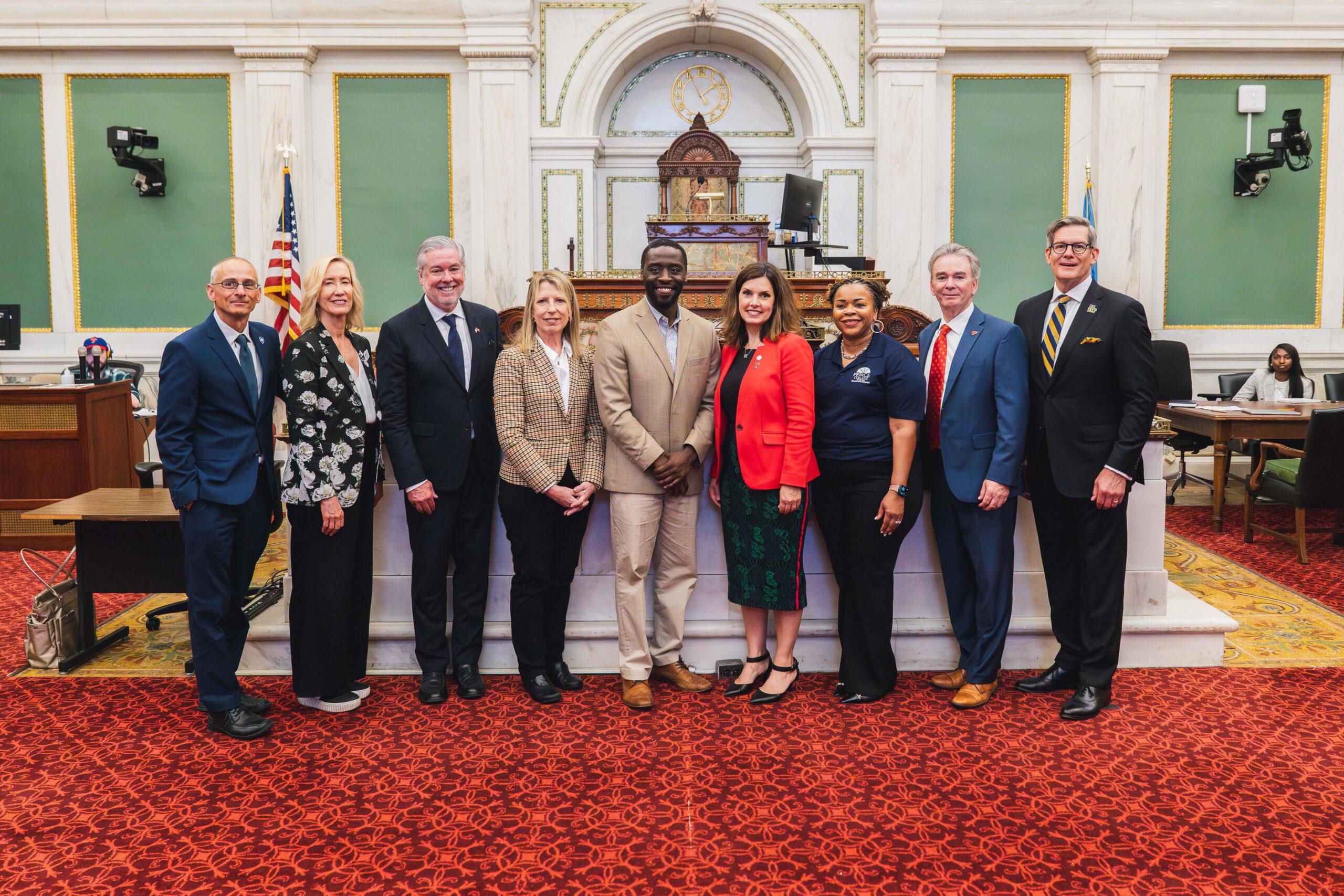 group of individuals posed at city hall
